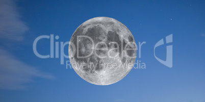 Full moon over blue sky