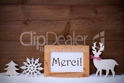 White Decoration On Snow, Text Merci Means Thank You White Decoration On Snow, Text Merci Means Thank You