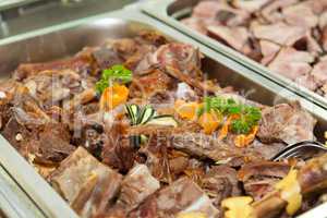 Lamb meat in a heated tray