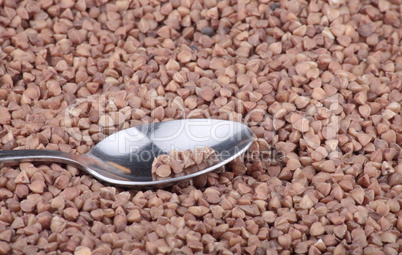 buckwheat background and teaspoon