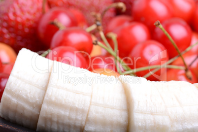 Composition with fruits cherry bananas strawberry