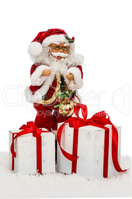 Santa Claus on snow with gift boxes - toy, isolated on white bac