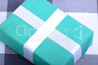 holiday Green gift box with white ribbon