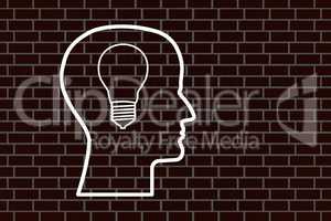 Head with bulb on a brick wall
