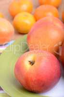 many different fruits for the health of the entire family, peach, mandarin, apple