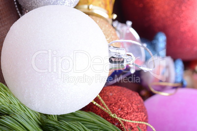 Closeup of beautiful Christmas baubles, Decorated christmas tree, holiday background, green tree eve branch close up with christmas balls