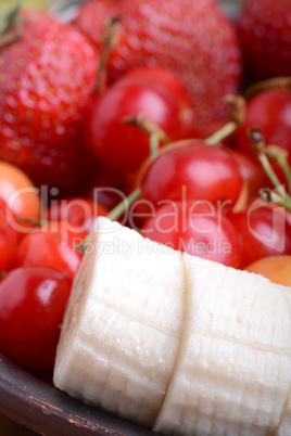Composition with fruits cherry bananas strawberry