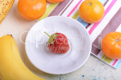 Fresh organic fruits ( strawberry, banana, mandarin, orange)