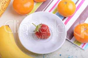 Fresh organic fruits ( strawberry, banana, mandarin, orange)