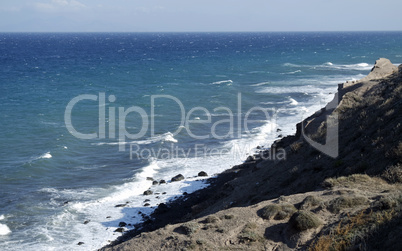 natural black lava beach koulombos on santorini island