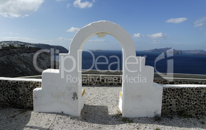 view through archway to aegean sea of santorini island