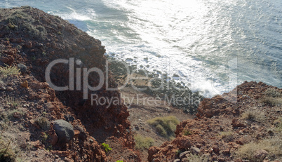 natural black lava beach koulombos on santorini island