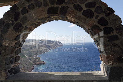 view through archway to aegean sea of santorini island