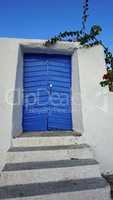 colorful door in oia village on santorini island