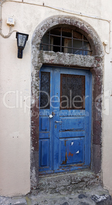 colorful door in oia village on santorini island