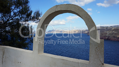 view through archway to aegean sea of santorini island