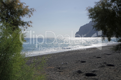 volcanic beach in kamari on santorini siland