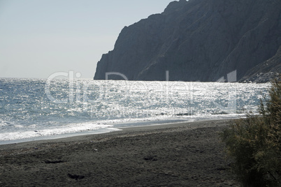 volcanic beach in kamari on santorini siland