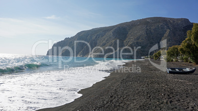 volcanic beach in kamari on santorini siland