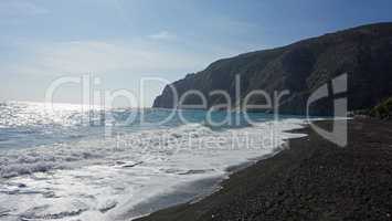 volcanic beach in kamari on santorini siland