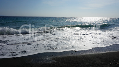 volcanic beach in kamari on santorini siland