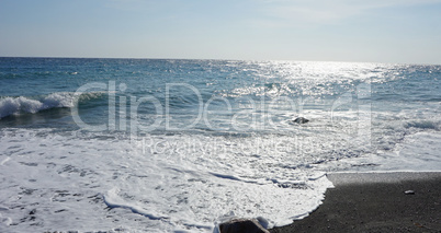 volcanic beach in kamari on santorini siland