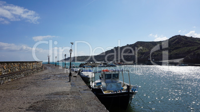 small harbor of porto castello on santorini