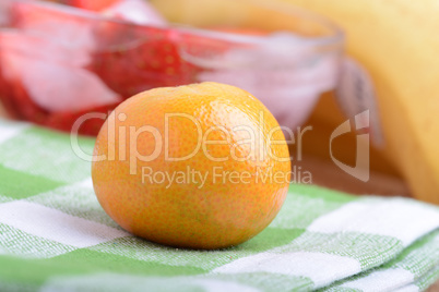 many different fruits for the health of the entire family, peach, mandarin, strawberry slices