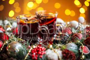 Christmas hot mulled wine with spices on a wooden table. The idea for creating greeting cards