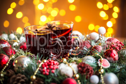 Christmas hot mulled wine with spices on a wooden table. The idea for creating greeting cards