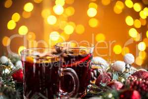 Christmas hot mulled wine with spices on a wooden table. The idea for creating greeting cards