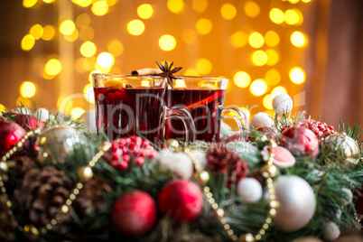 Christmas hot mulled wine with spices on a wooden table. The idea for creating greeting cards