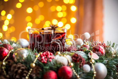 Christmas hot mulled wine with spices on a wooden table. The idea for creating greeting cards