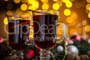 Christmas hot mulled wine with spices on a wooden table. The idea for creating greeting cards