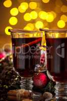 Christmas hot mulled wine with spices on a wooden table. The idea for creating greeting cards