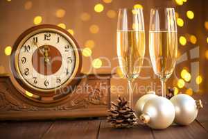 Christmas card. Glasses of champagne on New Year's Eve on the stand an ancient clock