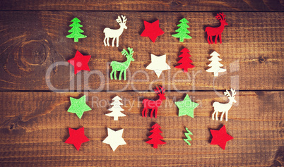 Christmas decoration on the wood background. Collection of xmas miniatures.
