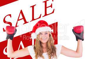 Composite image of festive blonde with boxing gloves