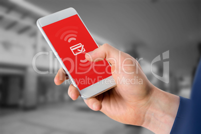 Composite image of businessman using mobile phone over white bac