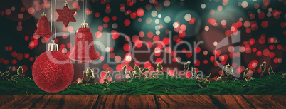 Composite image of red christmas bell decoration hanging