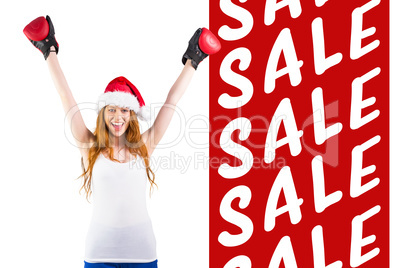 Composite image of festive redhead cheering with boxing gloves