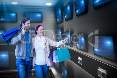 Composite image of smiling couple walking hand in hand and going