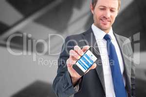 Composite image of businessman showing his smartphone screen
