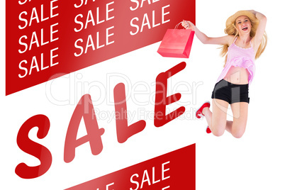 Composite image of pretty young blonde holding shopping bags