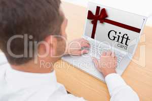 Composite image of gift card with festive bow