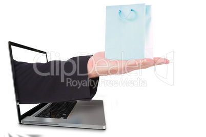 Composite image of businessman holding hand out in presentation