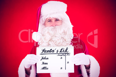 Composite image of smiling santa claus holding page