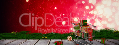 Composite image of trolley full of gifts