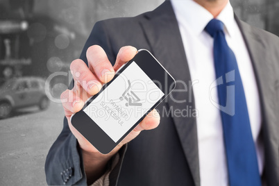 Composite image of businessman showing his smartphone screen