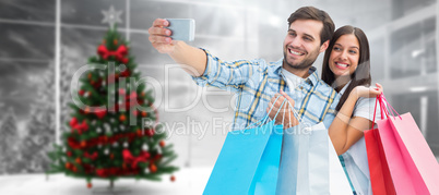 Composite image of happy couple taking a selfie